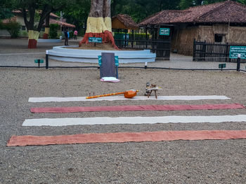 Empty bench on road in city