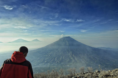 Rear view of man looking at mountain