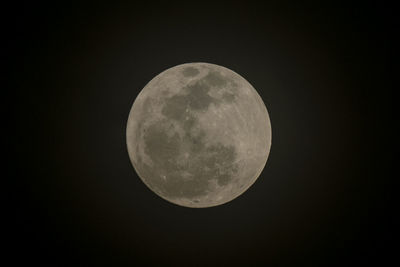 Low angle view of moon against sky at night