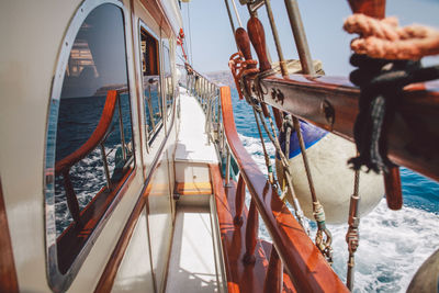 Ship sailing in sea on sunny day