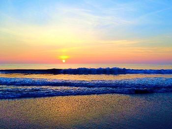 Scenic view of sea at sunset