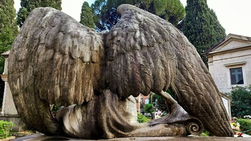 Close-up of animal statue against trees