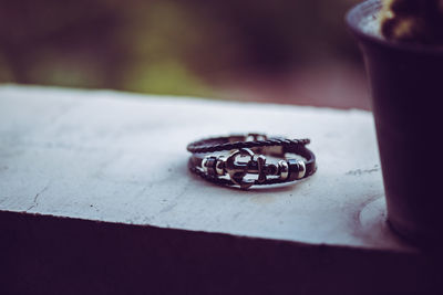 Close-up of wedding rings on table