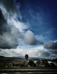 Scenic view of tree mountains against sky