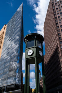 Low angle view of modern buildings against sky in city