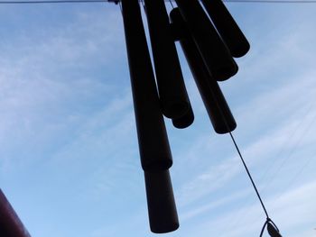 Low angle view of telephone pole against sky