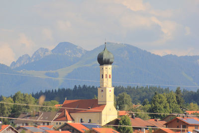 Onion dome church of bavaria against cloudy sky