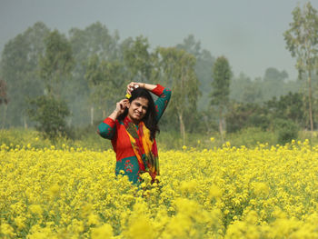 Full length of a girl standing on field