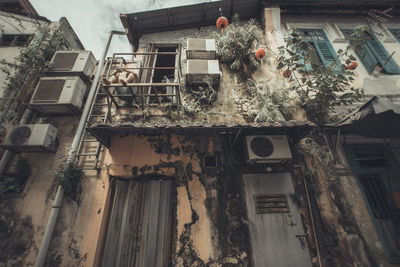 Low angle view of abandoned house