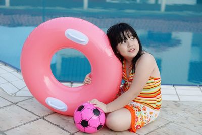 Girl standing in swimming pool