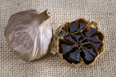 Close-up of rotten garlic bulb on fabric