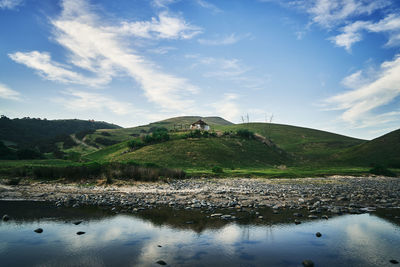 An abandoned traditional xhosa hut stands watch over this peaceful village.