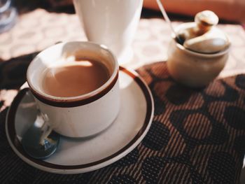 Close-up of coffee cup on table