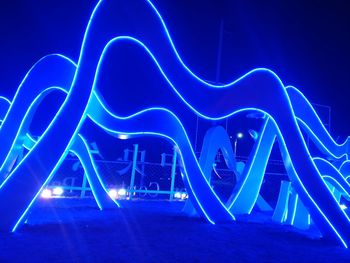 Light painting against blue sky at night