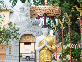 Statue against temple