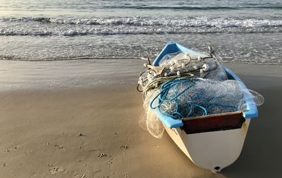 Boat moored on beach