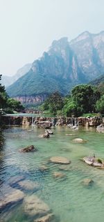 View of river with mountain range in background