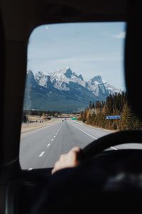 Cropped image of man driving car