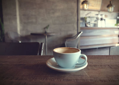 Coffee cup on table at cafe