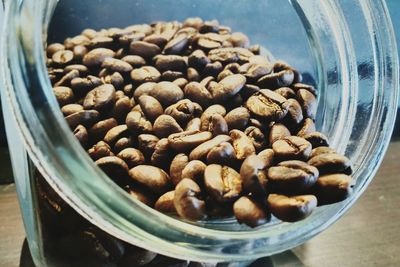Close-up of roasted coffee beans in glass jar