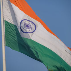 India flag flying high at connaught place with pride in blue sky, india flag fluttering, indian flag