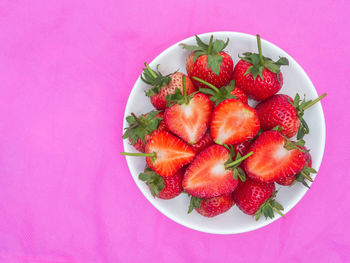 High angle view of strawberries in plate on table