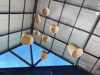 Low angle view of pendant lights hanging on ceiling