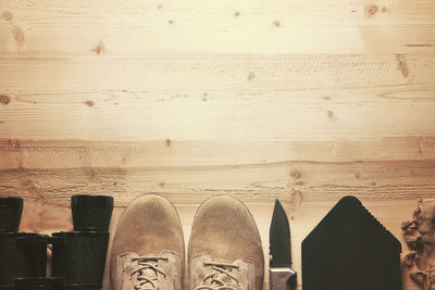 Low section of shoes on beach