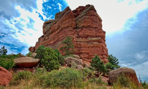 Low angle view of rock formation against sky