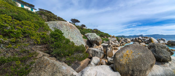 Panoramic view of rocks on beach against sky . boulder beach , cape town , south africa