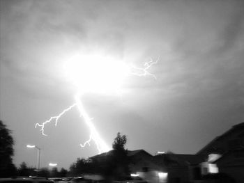 Low angle view of lightning against sky at night