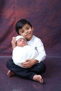 High angle view of mother and daughter at home