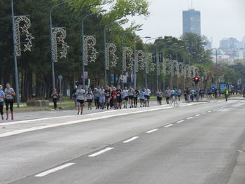 Group of people on road in city