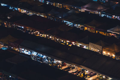 High angle view of illuminated market at night