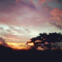 Scenic view of cloudy sky at sunset