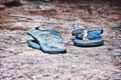 Close-up of shoes on ground