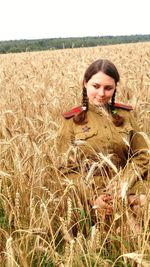 Portrait of young woman in field