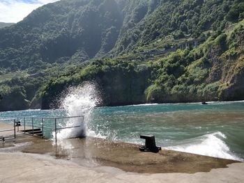 Scenic view of sea against mountains