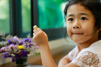 Portrait of cute girl looking at camera