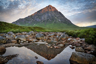 Scenic view of rocks in mountains against sky