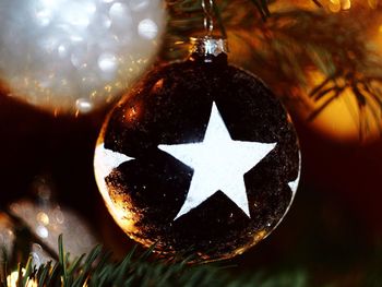 Close-up of christmas ornament hanging on tree