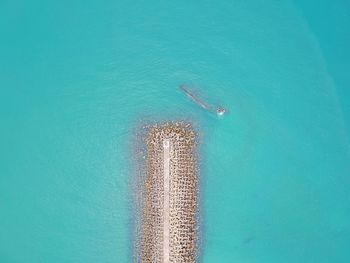 High angle view of sea against blue sky