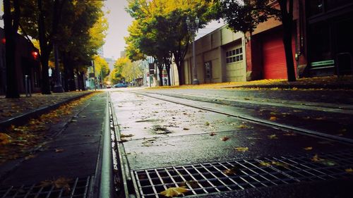 Railroad tracks by street in city