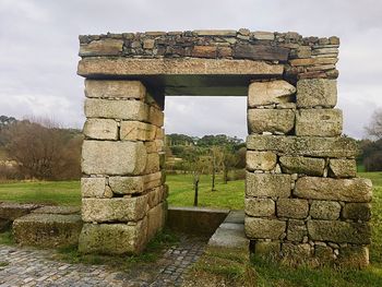 Old ruin building against cloudy sky