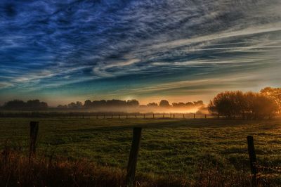 Scenic view of landscape against cloudy sky