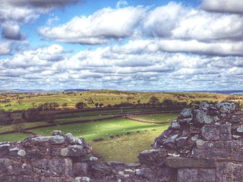 Scenic view of landscape against cloudy sky