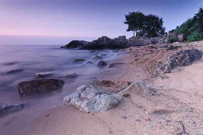 Scenic view of beach against clear sky