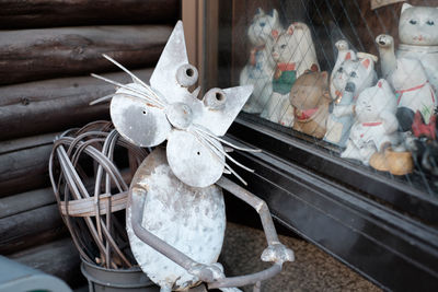 Close-up of objects on wooden wall