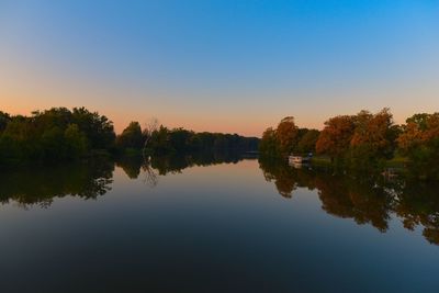 Reflection of trees in calm lake