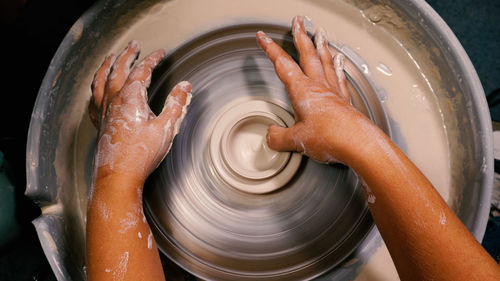 Cropped hand of man working in workshop